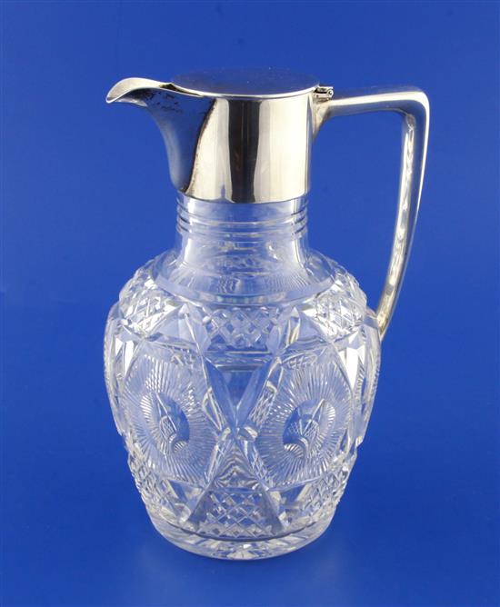 A 1920s silver mounted cut glass claret jug by Mappin & Webb, 7.75in.